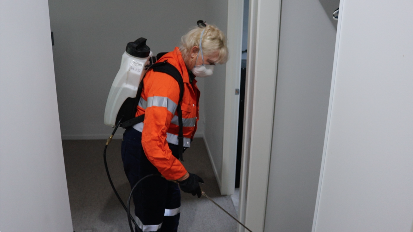 SPM technician performing a pest treatment.
